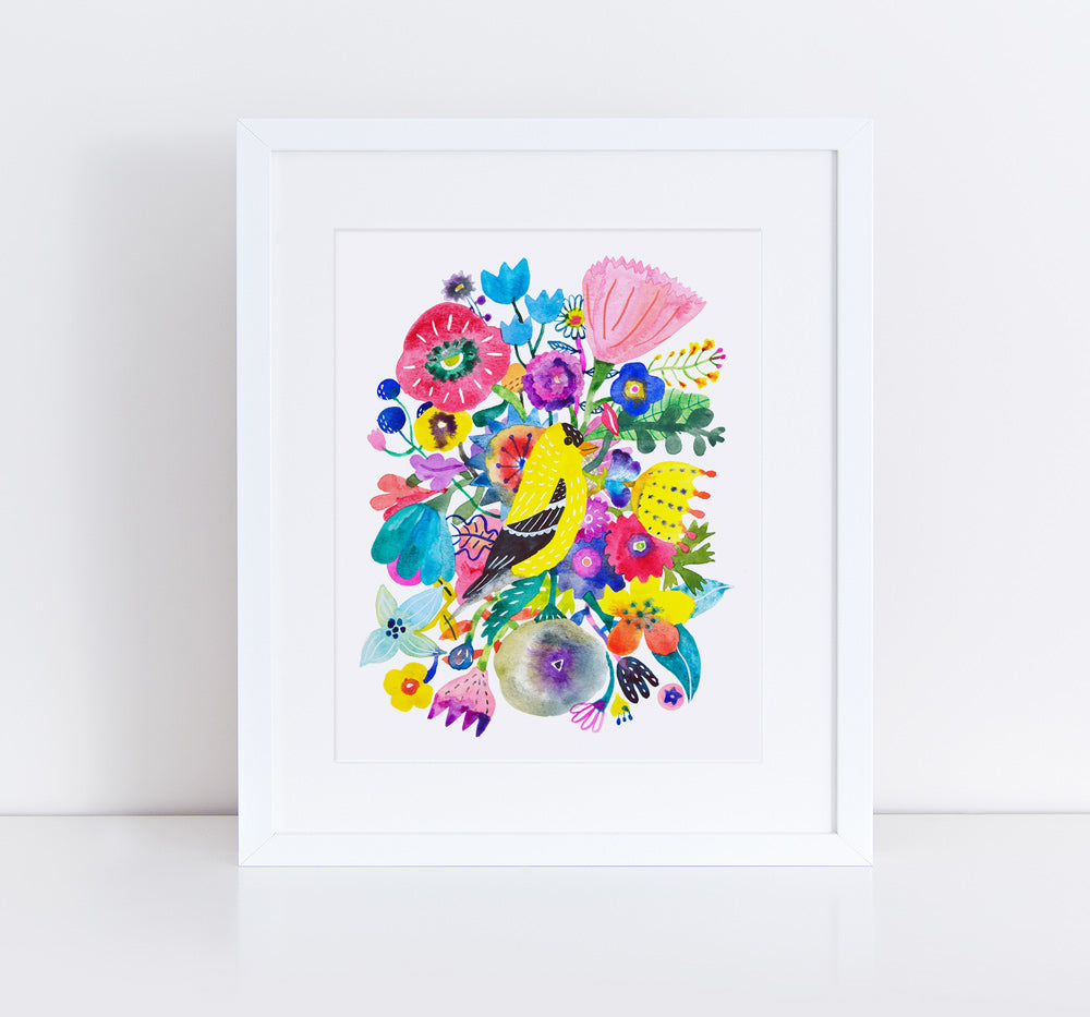 Colorful giclee art print featuring a vibrant goldfinch surrounded by diverse, whimsical flowers in a white frame, showcasing a cheerful and artistic floral composition with bold hues and intricate details