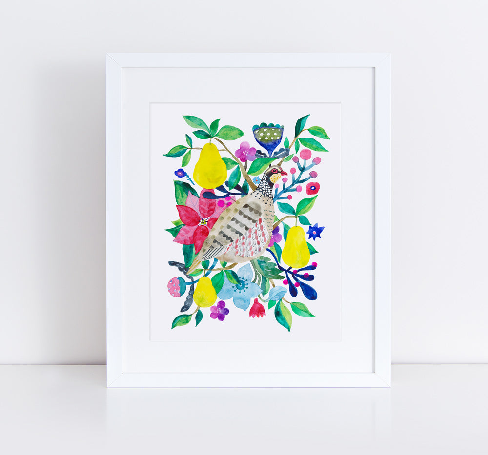 Colorful giclee art print featuring a partridge surrounded by vibrant floral elements, pears, and leaves in a whimsical watercolor style, framed in white against a light background