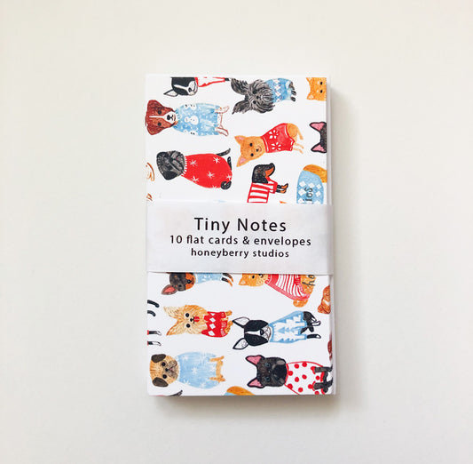 Cute set of tiny notes featuring colorful illustrations of dogs wearing sweaters, with a white band displaying product details. Perfect for mini greetings and gift tags.
