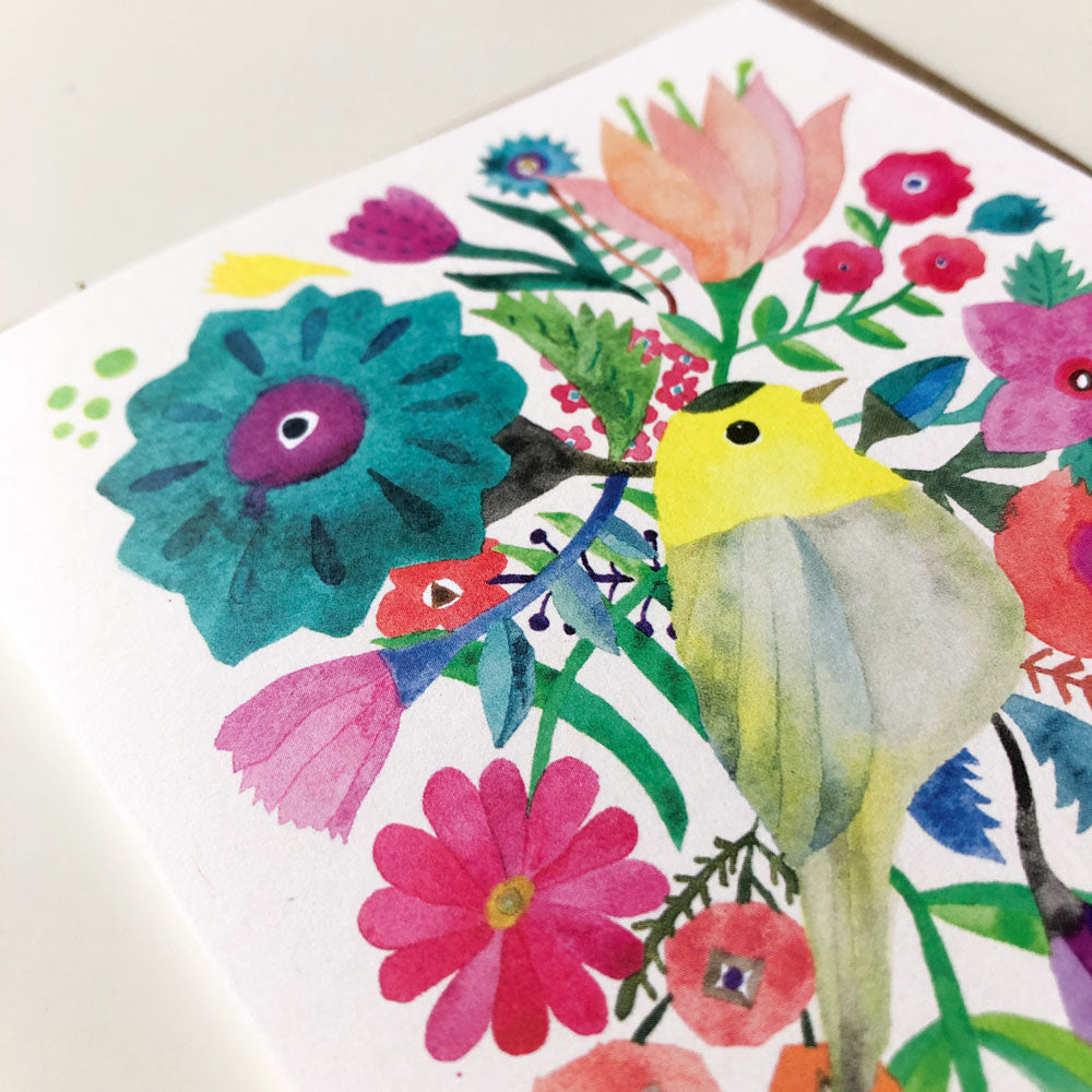 Vibrant watercolor greeting card featuring a yellow warbler surrounded by colorful flowers, including a large teal bloom, pink tulips, and various wildflowers on white background