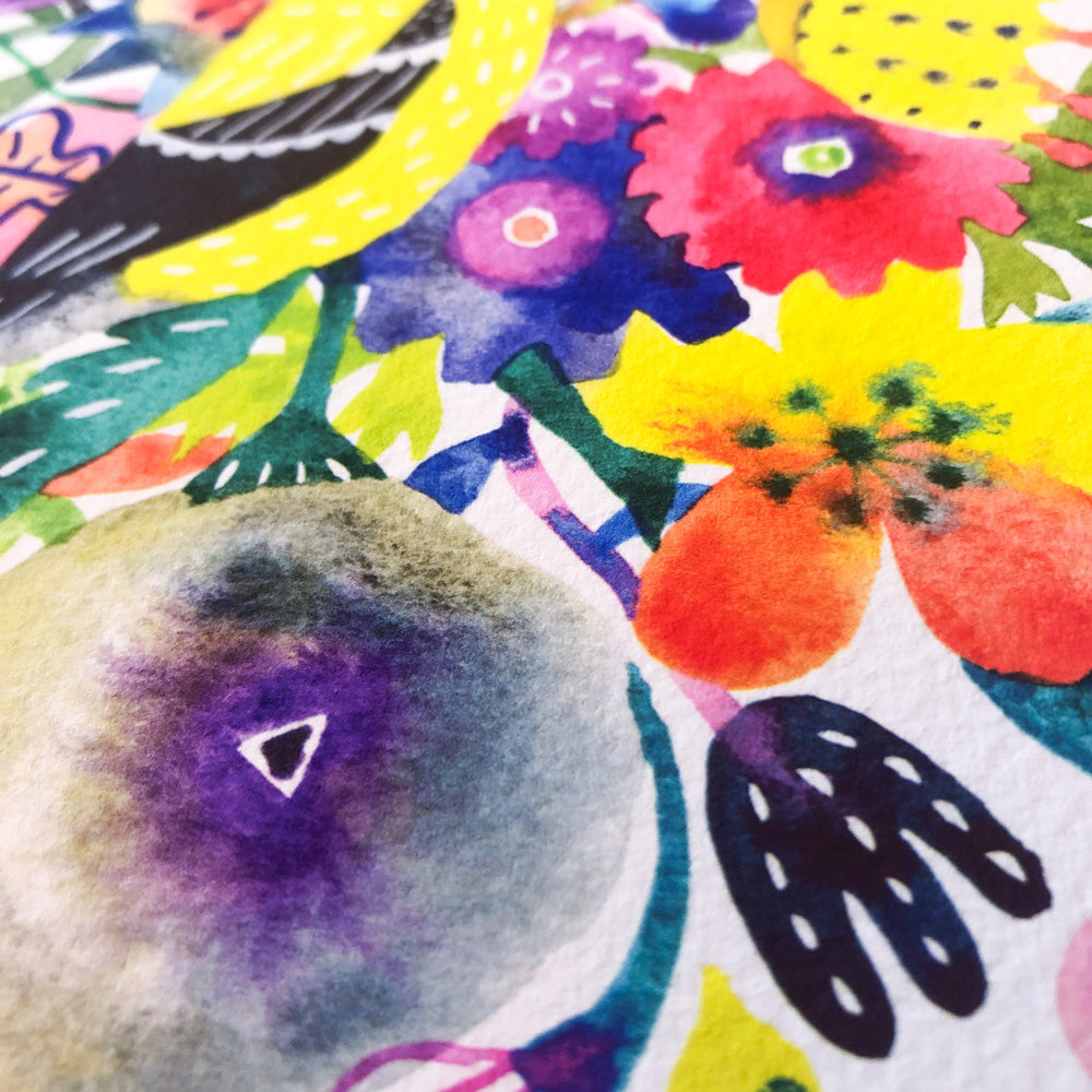 Vibrant watercolor print featuring a colorful goldfinch among an array of abstract flowers in red, yellow, purple, and orange. Close-up view showcasing the texture of the paper and the vivid, whimsical art style.