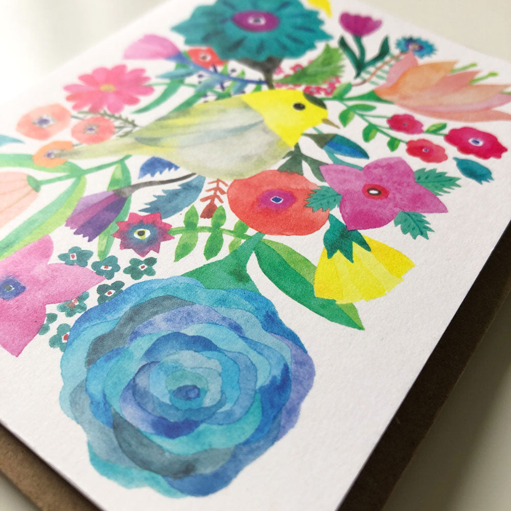Vibrant watercolor greeting card featuring colorful flowers and a yellow warbler bird, with a large blue rose in the foreground, perfect for various occasions