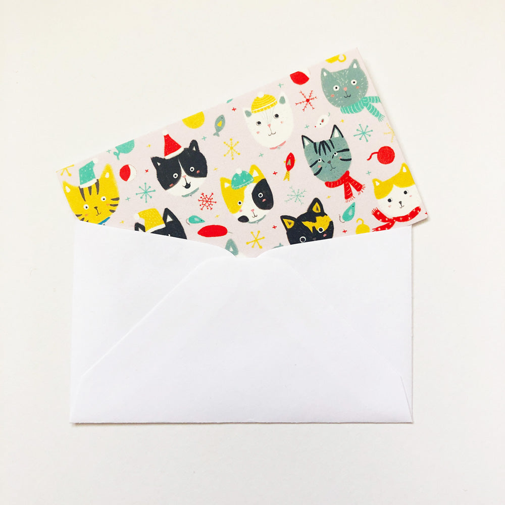 Colorful winter-themed tiny note card with cute cat illustrations peeking out of a white envelope, perfect for holiday greetings and gift tags
