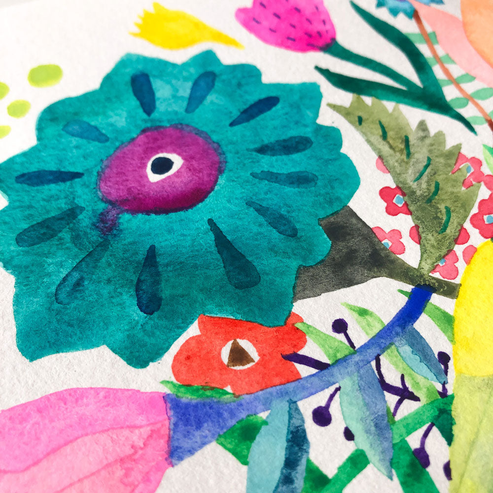 Vibrant watercolor painting featuring a large teal flower with purple center, surrounded by colorful abstract floral shapes in yellow, pink, and green on white paper, showcasing a whimsical and playful botanical composition