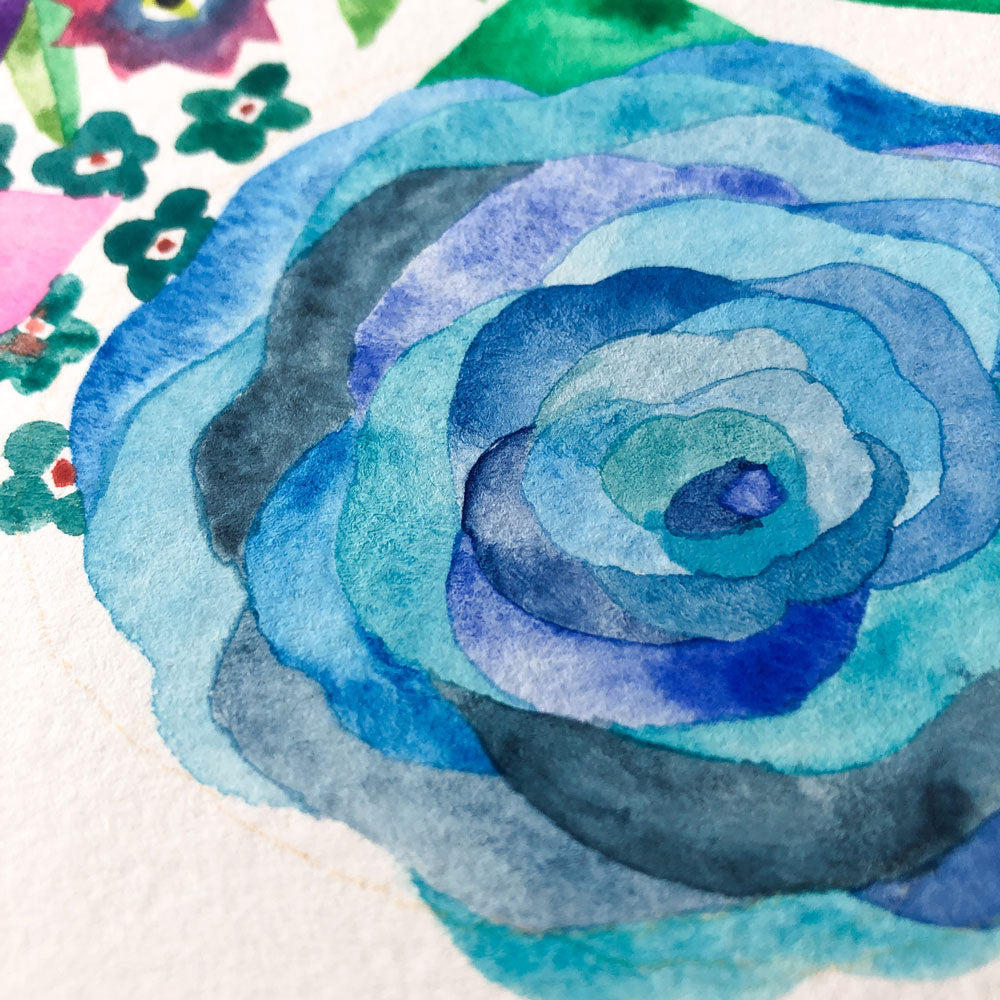Original watercolor painting featuring a vibrant blue rose with layered petals in shades of turquoise and indigo, surrounded by small colorful flowers on textured paper, showcasing delicate brushwork and artistic detail