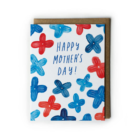 Blue and red floral Mother's Day card with handwritten text, featuring stylized cross-shaped flowers on white background, paired with brown kraft envelope, perfect for unique holiday greetings