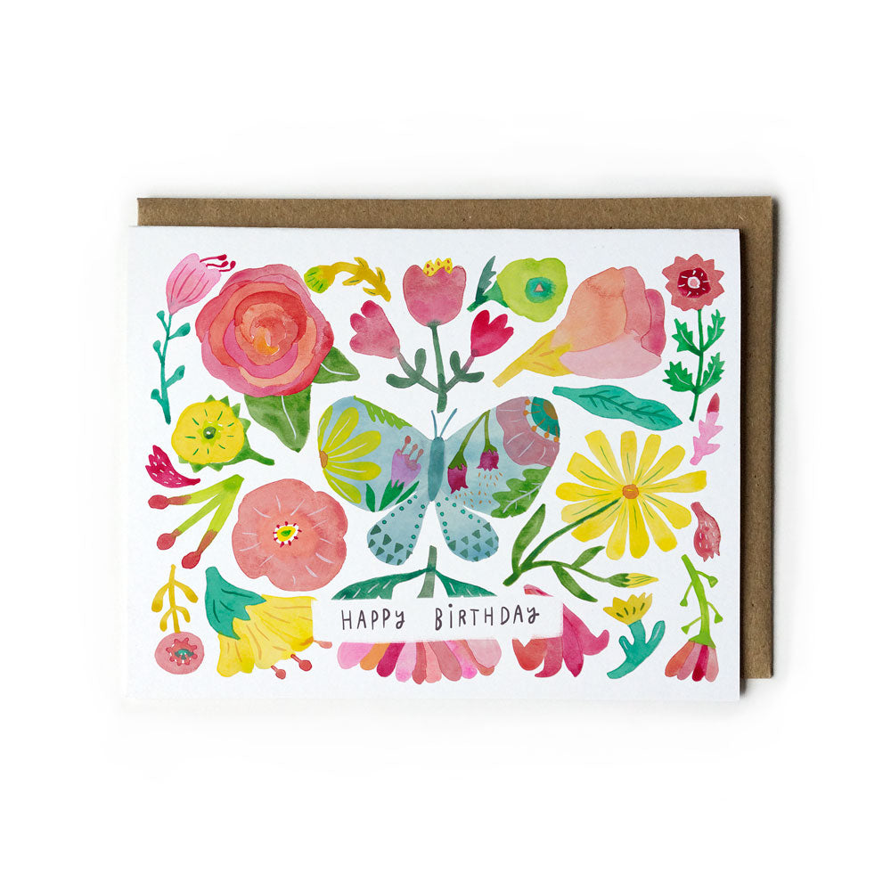 Colorful watercolor birthday card featuring a butterfly surrounded by vibrant flowers and leaves, with "Happy Birthday" text in the center, accompanied by a kraft paper envelope