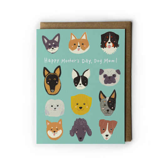 Dog Mother's Day card featuring colorful illustrations of 12 different dog breed faces on a mint green background, with text "Happy Mother's Day, Dog Mom!" Accompanied by a kraft paper envelope.