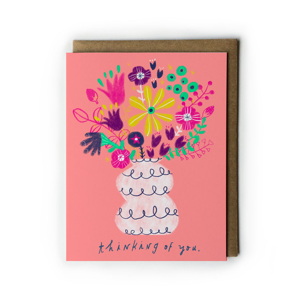 Pink greeting card with colorful hand-drawn floral bouquet in white vase, featuring "Thinking of you" message, paired with kraft paper envelope