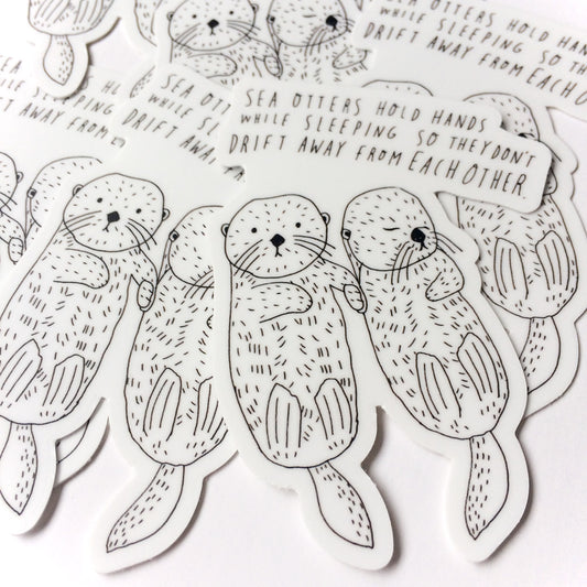 Hand-drawn sea otter stickers with text explaining how otters hold hands while sleeping to avoid drifting apart, featuring cute illustrations of otters in various poses and a speech bubble with handwritten text