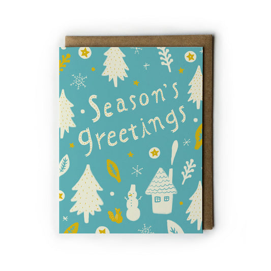 Festive Season's Greetings card featuring white Christmas trees, snowman, house, and squirrel on turquoise background with gold accents and kraft envelope, perfect for holiday wishes