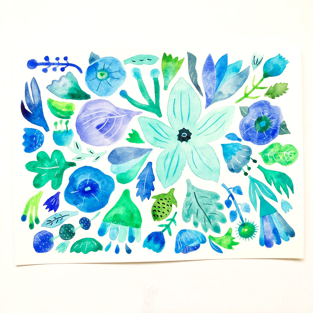 Watercolor painting of various blue and green flowers, leaves, and botanical elements arranged in a vibrant floral composition on white paper, perfect for a Mazel Tov greeting card