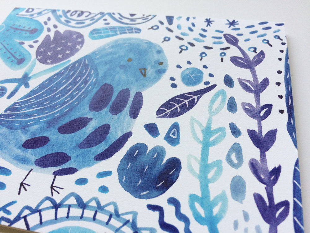 Watercolor notecard featuring a whimsical blue bird design with floral and nature-inspired elements in shades of blue and purple on white background, showcasing the "Bluebird of Happiness" theme for a cheerful greeting card