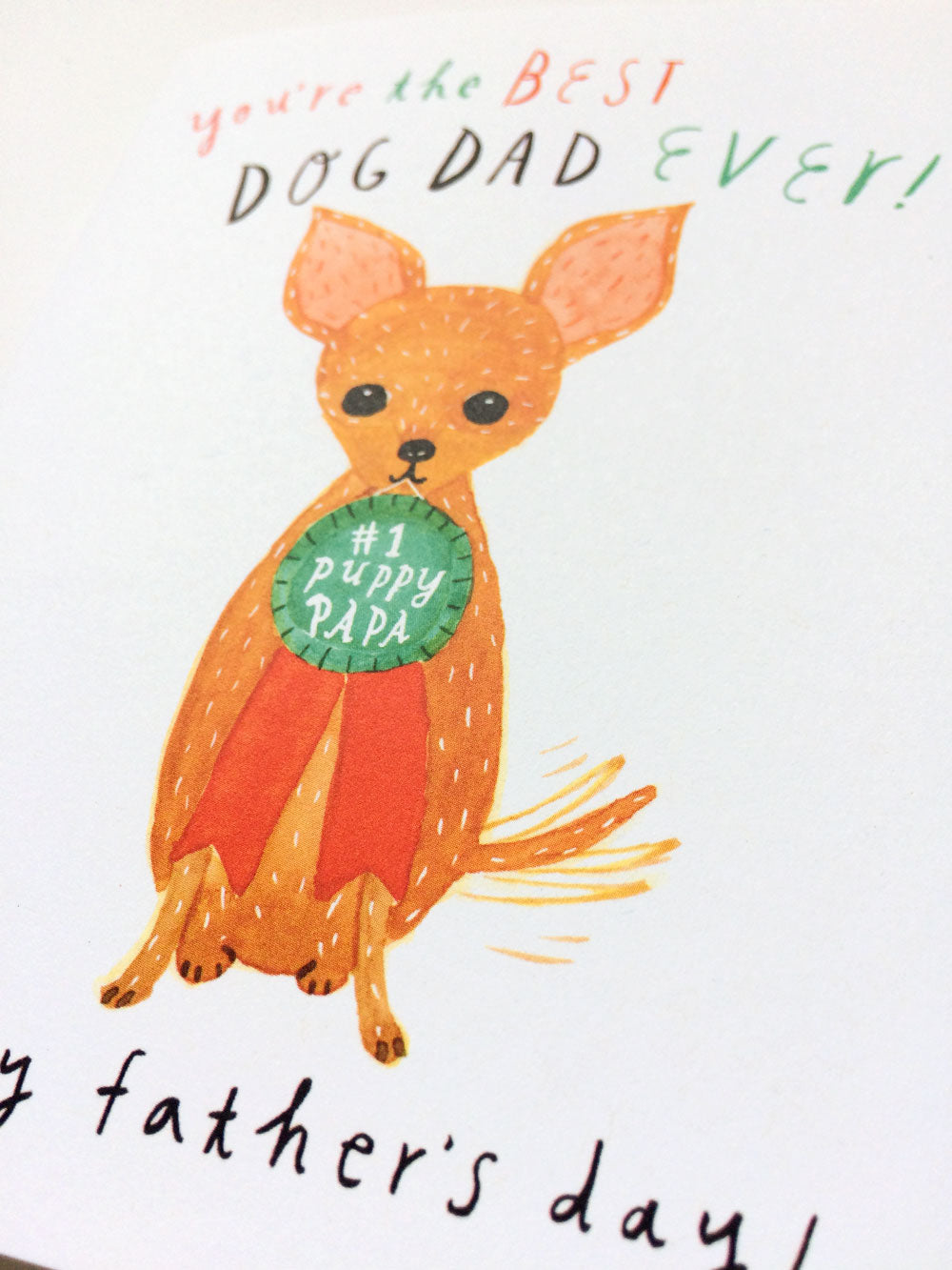 Watercolor illustration of a chihuahua holding a green badge saying "1 Puppy Papa" with text "you're the BEST DOG DAD EVER!" and "happy father's day!" for a Father's Day card