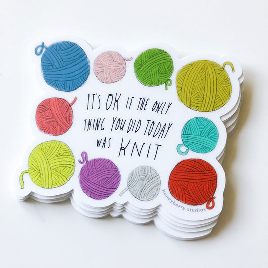 Colorful vinyl sticker featuring yarn balls in various hues surrounding text "It's OK if the only thing you did today was knit", perfect for knitting enthusiasts