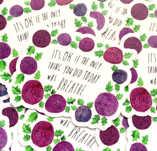 Inspirational vinyl stickers with purple floral pattern and text "It's OK if the only thing you did today was breathe" arranged in a repeating design on white background