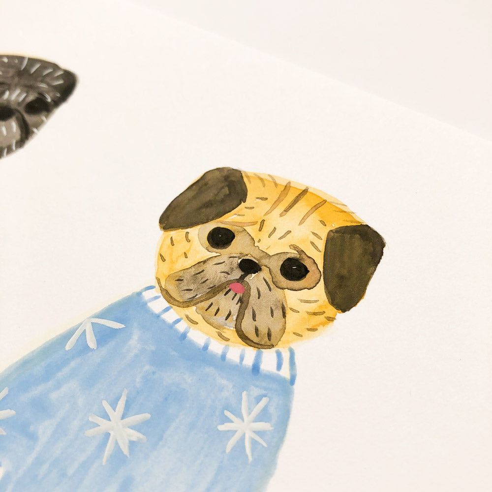 Watercolor painting of a cute pug dog wearing a light blue sweater with white star patterns, showcasing the artist's whimsical style and attention to detail in this original 5.5"x7" artwork