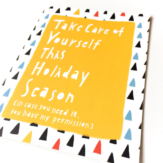Holiday self-care greeting card with yellow background and colorful triangle border, featuring handwritten text "Take Care of Yourself This Holiday Season" and playful permission note, perfect for encouragement during potentially stressful times