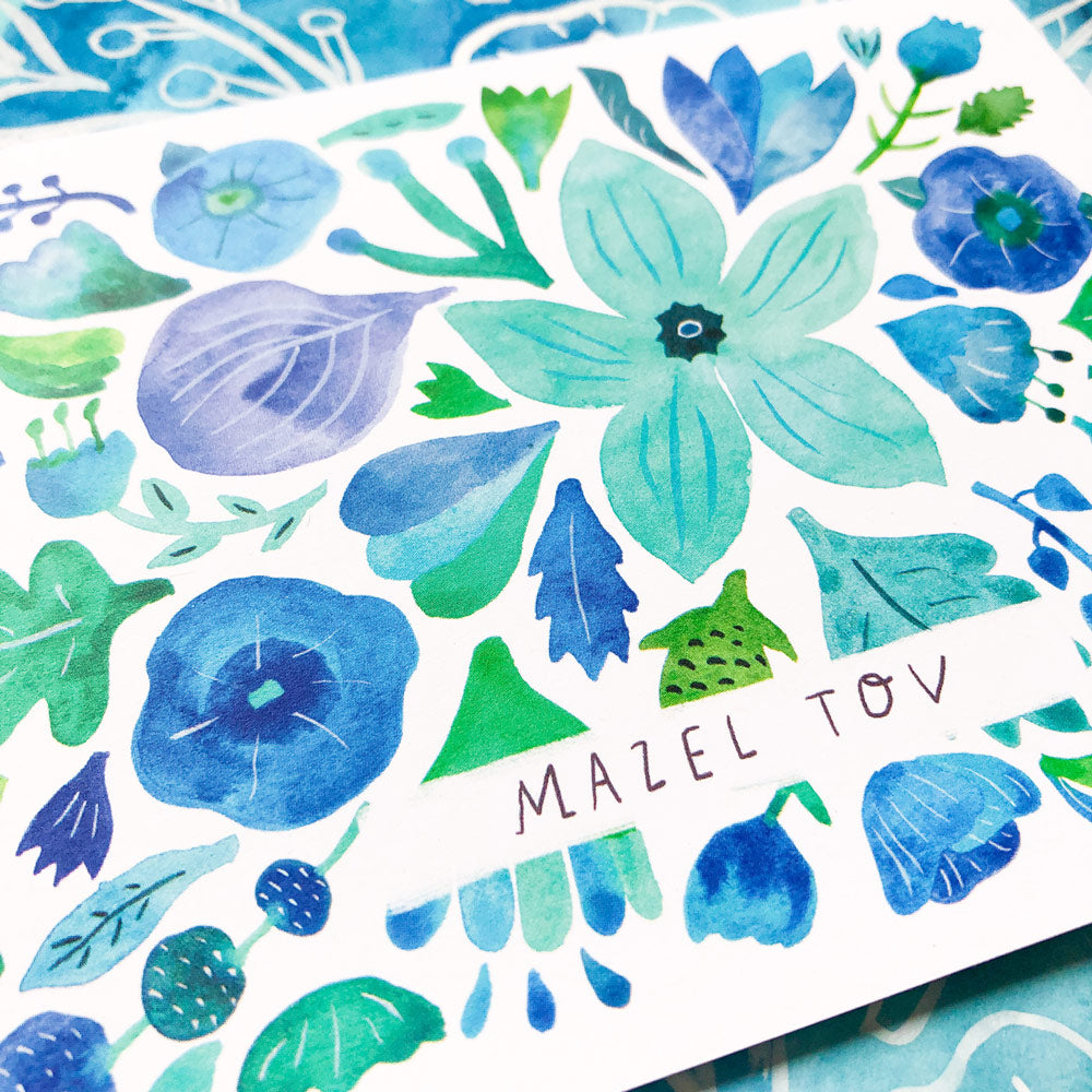 Vibrant watercolor greeting card featuring blue and green floral designs with "Mazel Tov" text, perfect for joyous celebrations and congratulatory messages