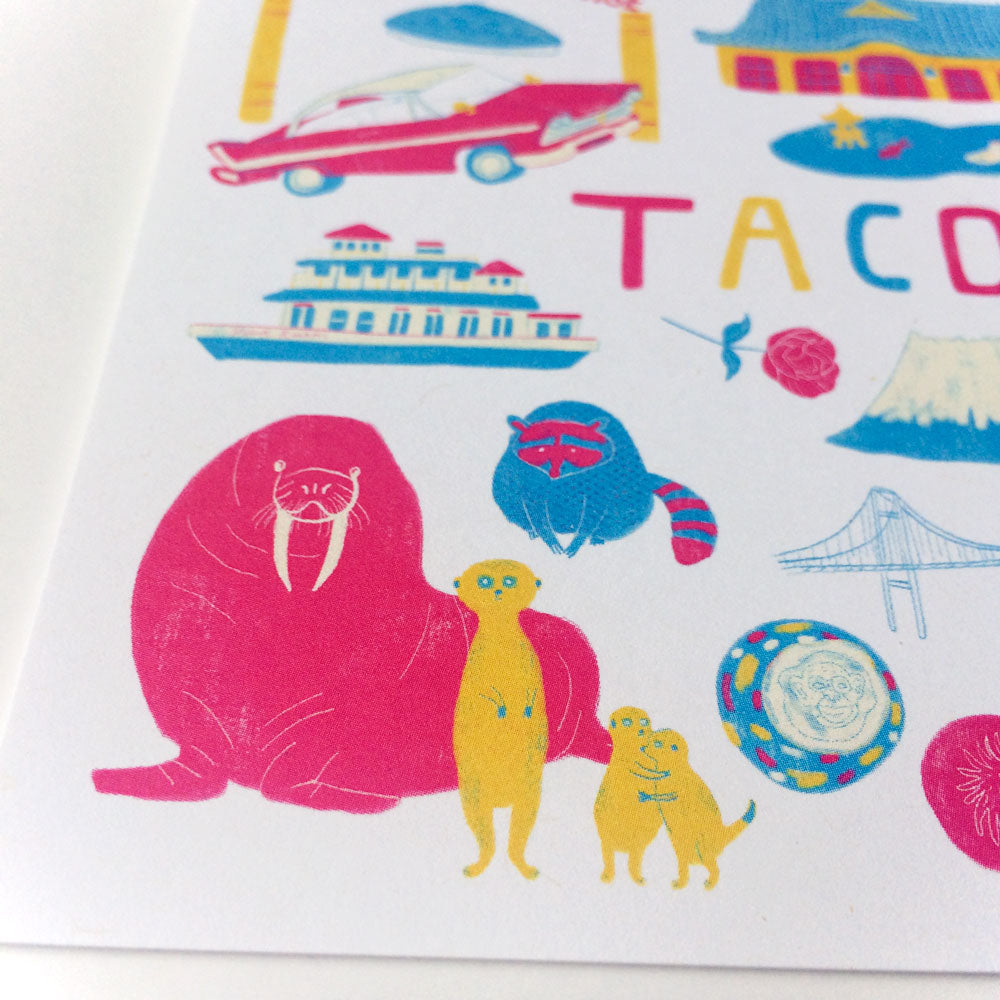 Colorful illustration of Tacoma landmarks and icons including walrus, meerkats, car, ferry, bridge, and text spelling TACO, showcasing the city's eclectic culture and attractions on a greeting card design