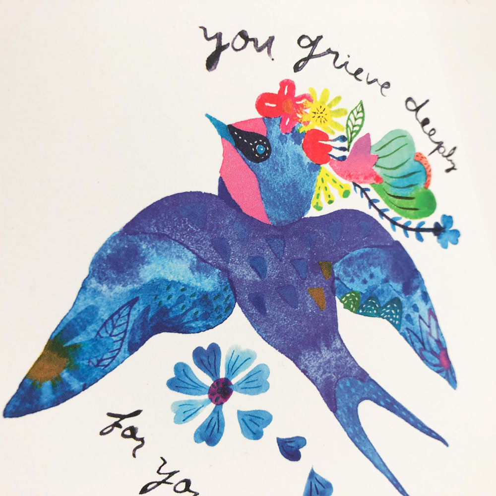 Watercolor sympathy card featuring a vibrant blue swallow with colorful flowers, text reads "You grieve deeply for you