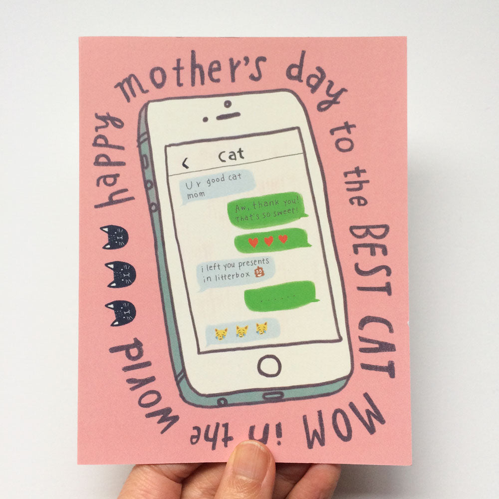 Mothers Day card featuring a smartphone screen with cat-themed text messages, surrounded by text reading Happy mothers day to the best cat mom in the world, held by a hand against a pink background