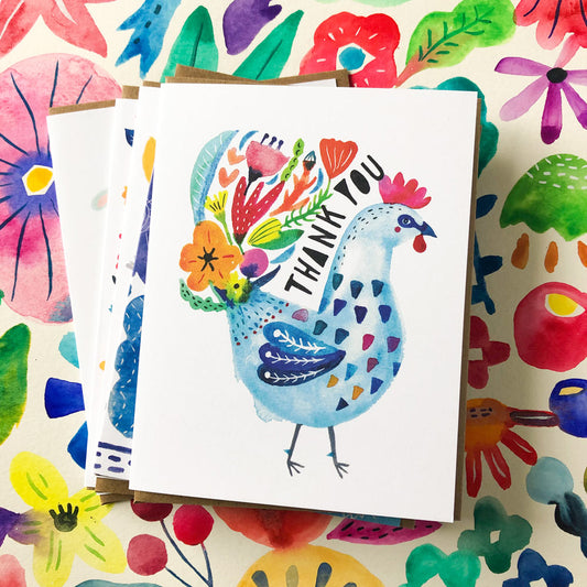 Colorful thank you card featuring a whimsical blue rooster with floral patterns, displayed on a vibrant floral background. Part of a bundle of diverse greeting cards for various occasions.