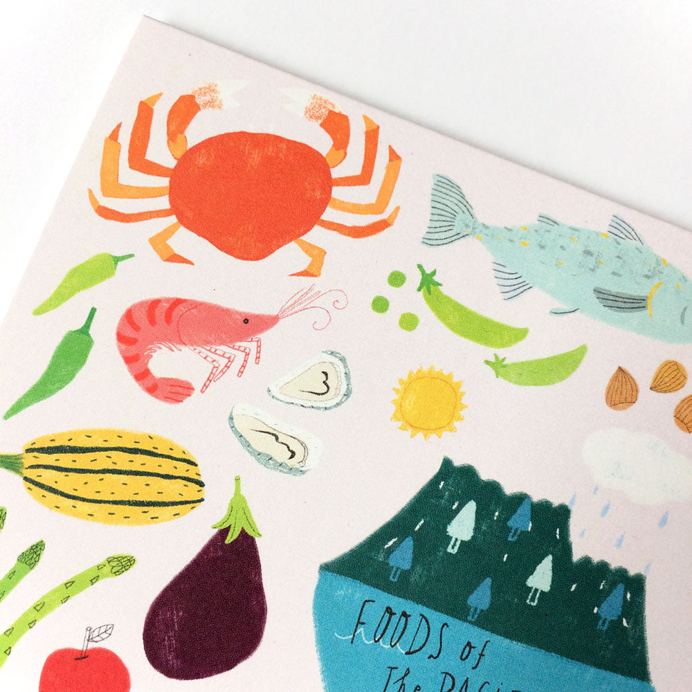 Colorful illustration of Pacific Northwest foods including crab, fish, shrimp, vegetables, and mountains, representing local produce and cuisine on a greeting card