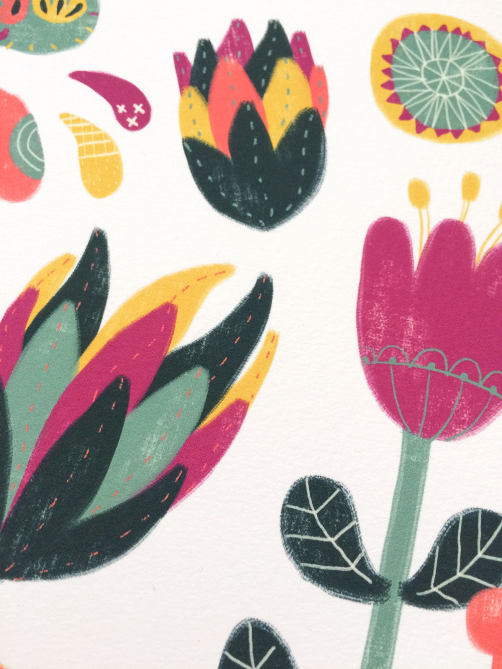 Colorful abstract botanical illustration featuring vibrant flowers and leaves in pink, yellow, green, and black on a white background, showcasing a whimsical and playful floral design