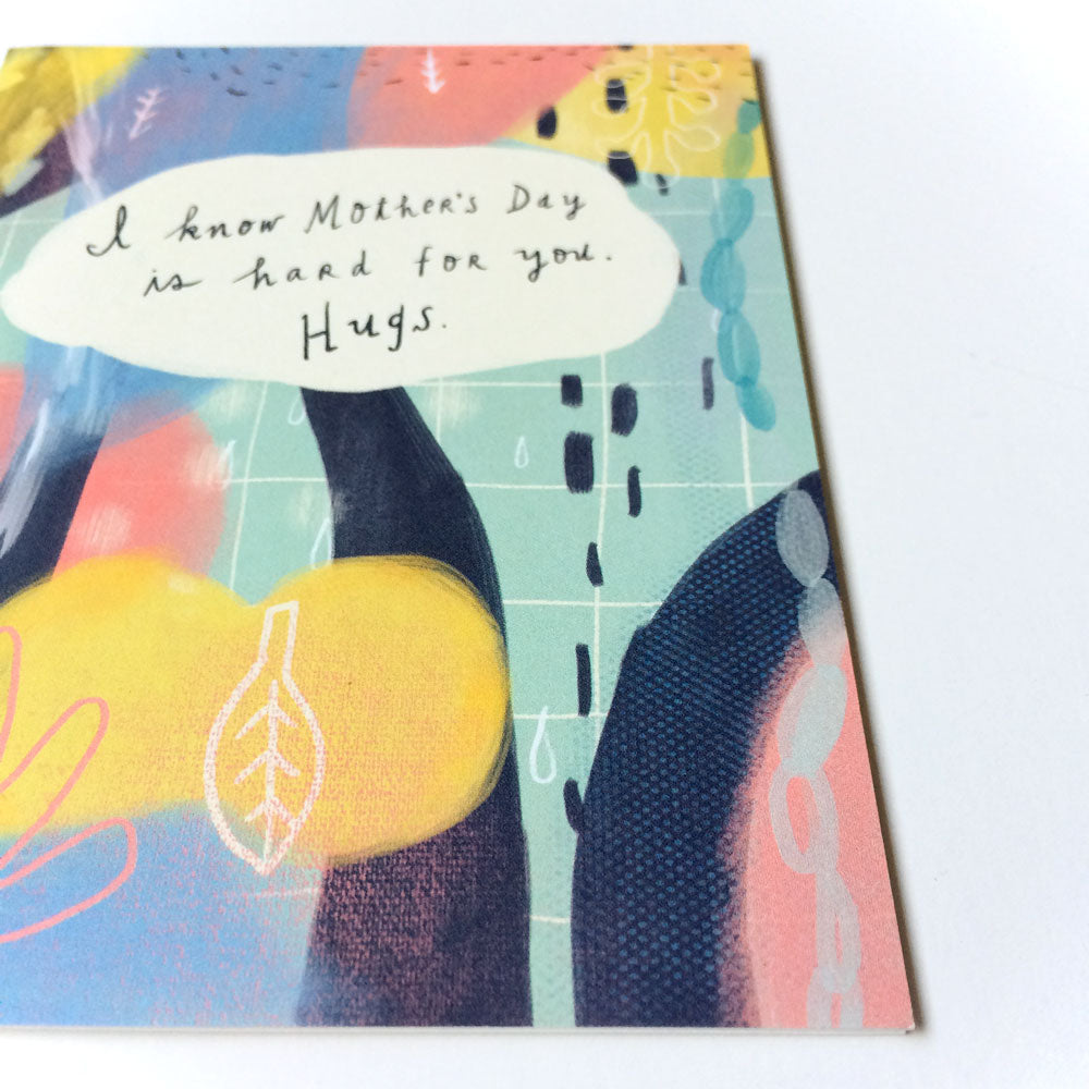 Empathetic Mother's Day card with colorful abstract design featuring handwritten message "I know Mother's Day is hard for you. Hugs." on a white speech bubble, surrounded by vibrant pastel shapes and patterns.