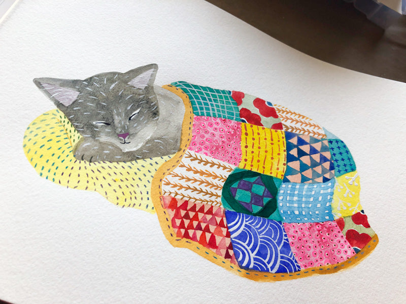 Watercolor illustration of a gray cat sleeping peacefully on a colorful patchwork quilt with various patterns and designs, representing comfort and rest for those facing long-term health challenges