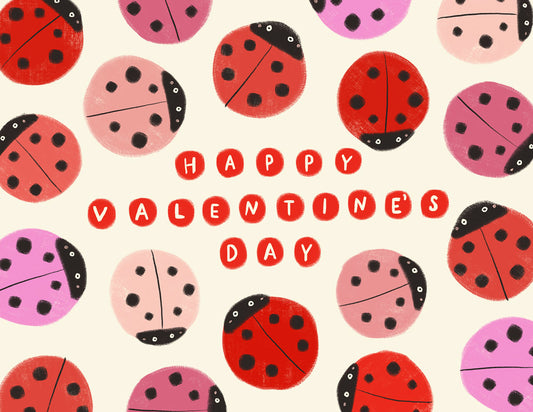 Whimsical Valentine's Day card featuring colorful ladybugs in red, pink, and purple on a white background. Hand-lettered "Happy Valentine's Day" message in red circular elements at the center, surrounded by ladybug illustrations.