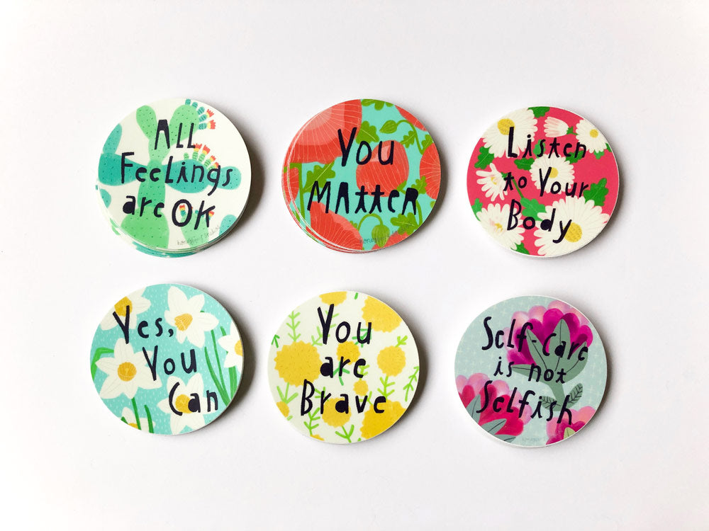 Colorful circular stickers with positive affirmations including "You Matter" and "You are Brave" on floral backgrounds, perfect for self-care and motivation.