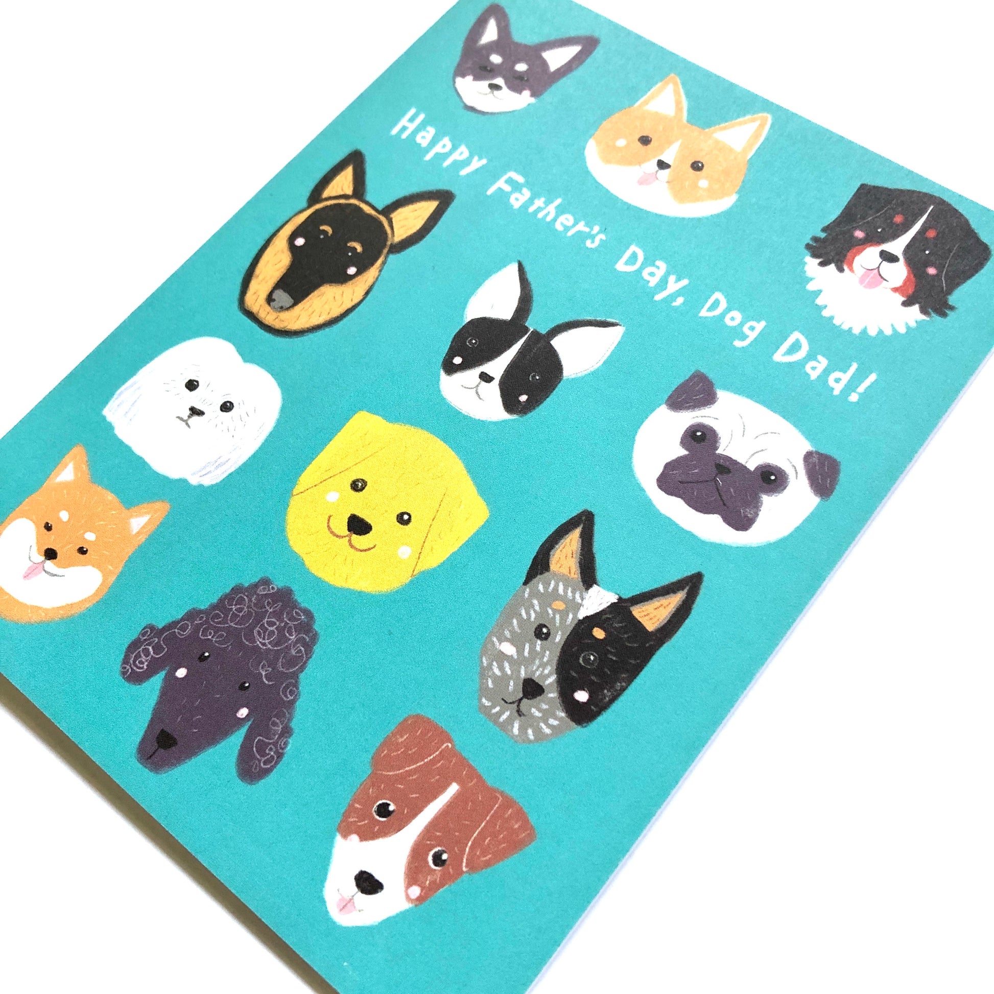 Father's Day card for dog dads featuring colorful cartoon dog faces of various breeds on a teal background, with 'Happy Father's Day, Dog Dad!' text