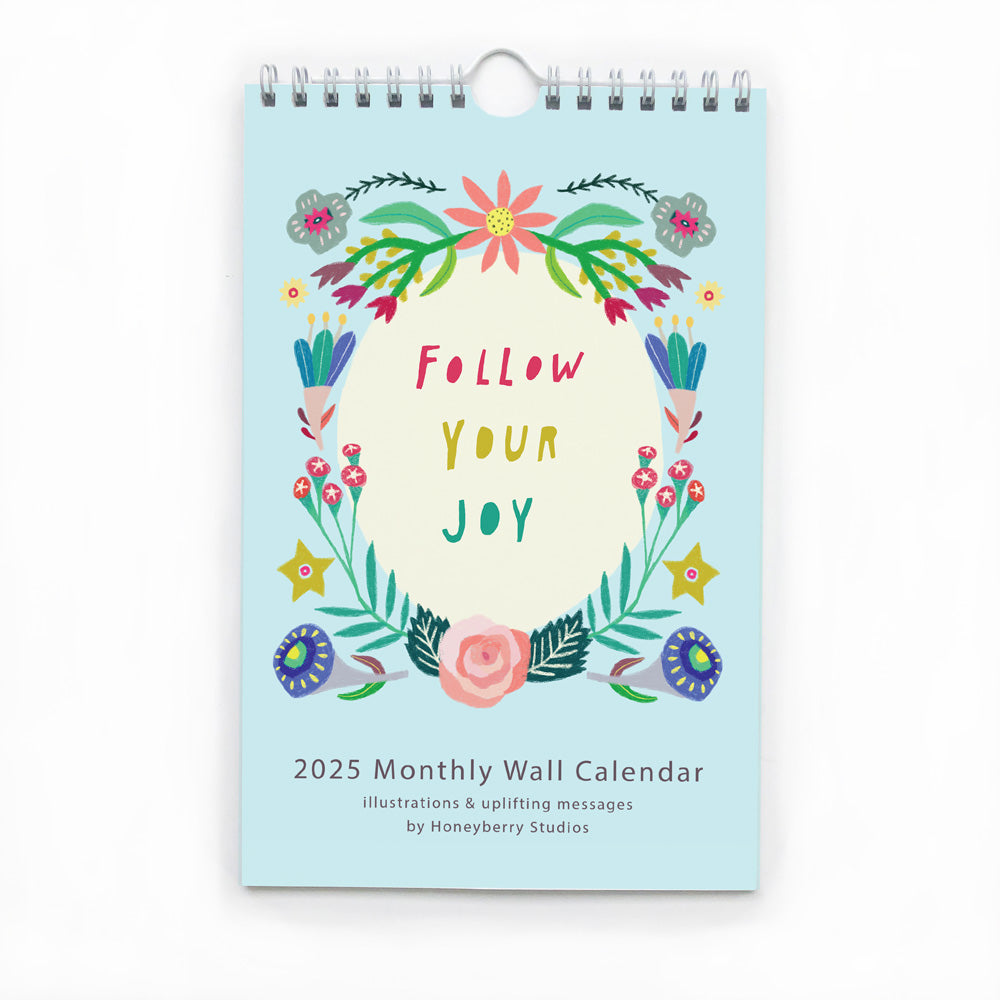 Colorful 2025 monthly wall calendar featuring floral illustration and "Follow Your Joy" text, designed with uplifting messages and vibrant artwork for daily inspiration and positivity.