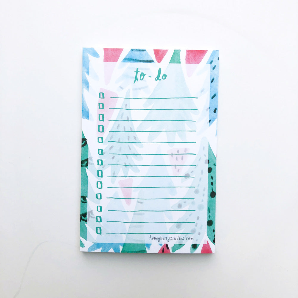 Christmas Forest To-Do List notepad with colorful watercolor Christmas tree illustrations, featuring lines for tasks and a white background. Perfect for holiday organization and gift-giving.