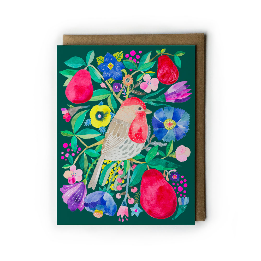 Vibrant holiday greeting card featuring colorful watercolor illustration of house finch surrounded by red pears, flowers, and foliage on dark green background, with kraft envelope