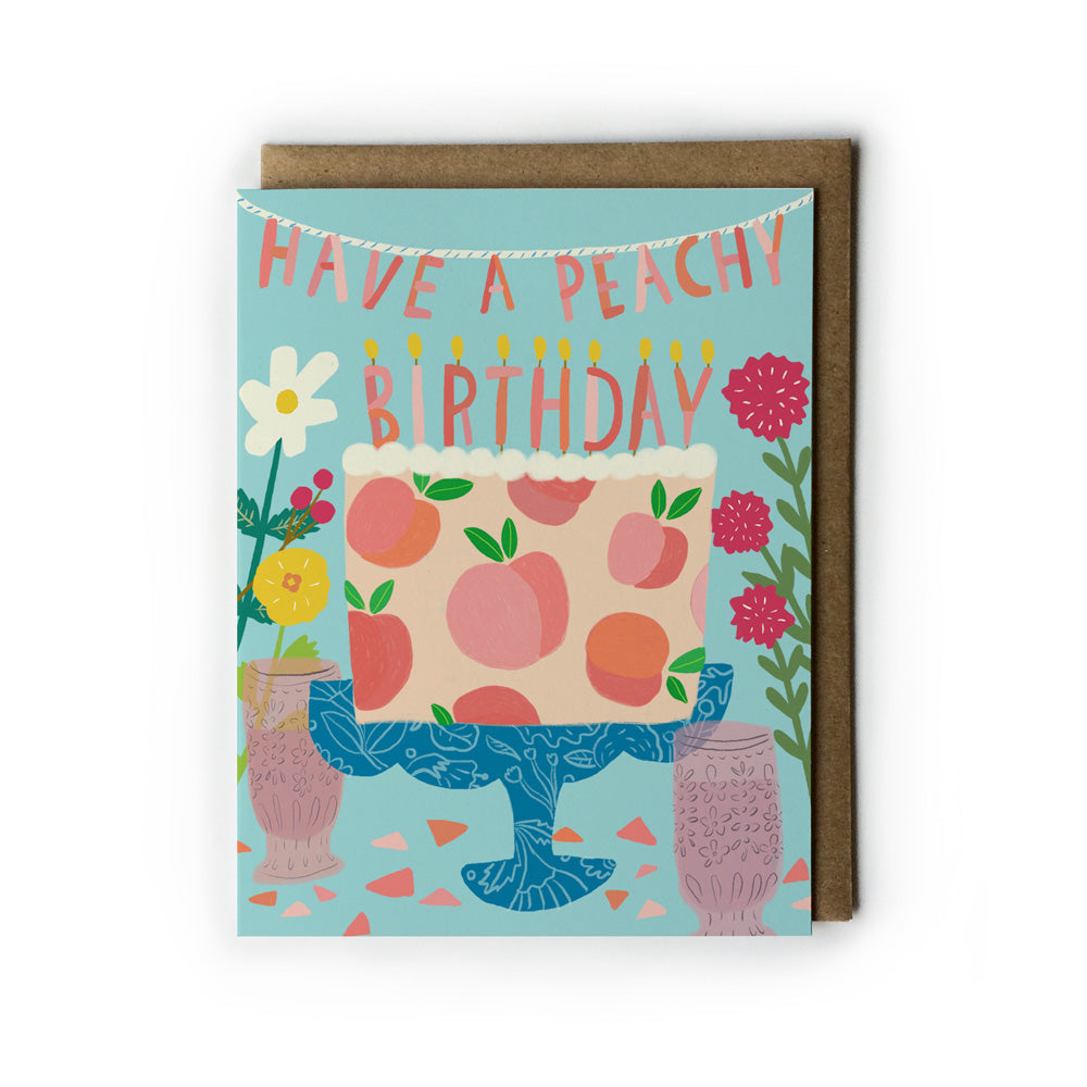 Birthday card with peach-themed design and 'Have a Peachy Birthday' text on a light blue  background