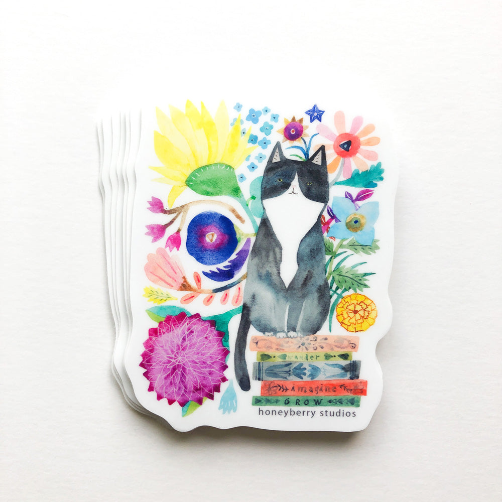 Watercolor sticker featuring tuxedo cat surrounded by vibrant flowers, books, and colorful elements on white background, perfect for cat lovers and book enthusiasts