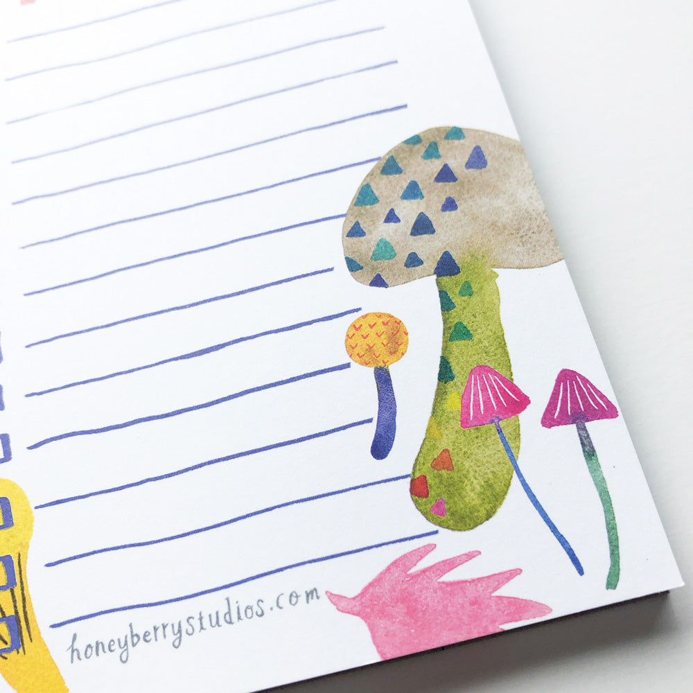 Colorful watercolor mushroom illustrations on a lined notepad, featuring whimsical designs with triangular patterns, vibrant hues, and varying shapes, perfect for nature-inspired to-do lists