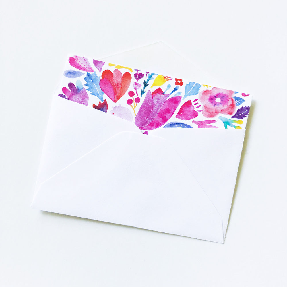 Tiny note card with vibrant watercolor floral design featuring red, pink, and purple flowers along the top edge, perfect for mini greetings or gift tags