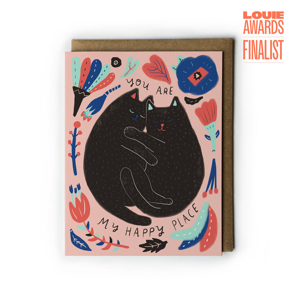 Greeting card with a black cat illustration and floral elements on a pink background, Louie Awards Finalist text.