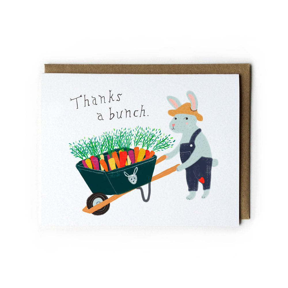 Cute thank you card featuring a cartoon bunny pushing a wheelbarrow full of colorful carrots, with text "Thanks a bunch" and a brown kraft envelope