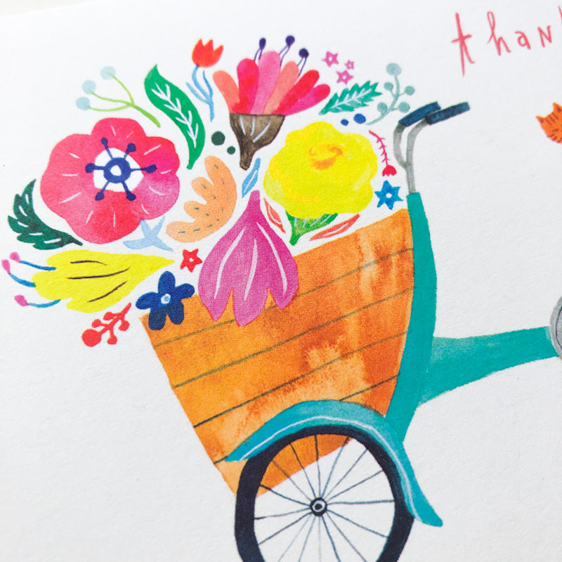 Colorful illustration of a bicycle basket filled with vibrant flowers, including pink, yellow, and purple blooms, on a white background, part of a thank you card design