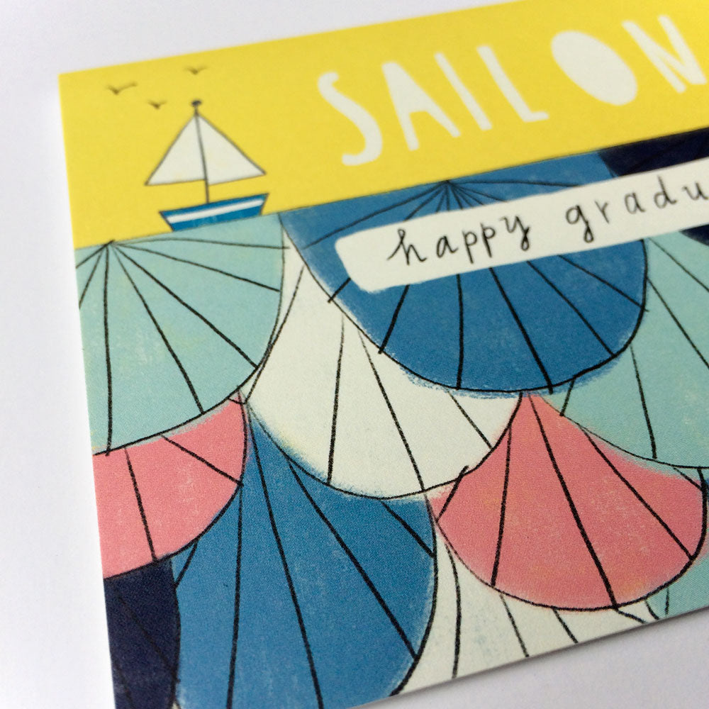 Colorful graduation card featuring abstract waves, a sailboat, and hand-lettered "Sail On" and "happy graduation" messages, symbolizing the journey ahead for graduates